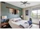 Relaxing bedroom with a decorative wall hanging, neutral colors, and ample natural light at 3420 W 32Nd Ave # 203, Denver, CO 80211