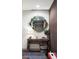Charming entryway featuring a round mirror, decorative table, and stylish rug at 3420 W 32Nd Ave # 203, Denver, CO 80211