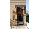 Modern brick building entrance with a metal awning, displaying the address and featuring a secure entry system at 3420 W 32Nd Ave # 203, Denver, CO 80211