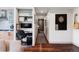 Cozy living space with a built-in office nook, a dartboard, and stylish decor at 3420 W 32Nd Ave # 203, Denver, CO 80211