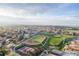 Aerial shot showcasing the property's proximity to the neighborhood school and athletic fields at 8079 W 67Th Ave, Arvada, CO 80004