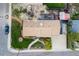 Aerial view of a well-maintained home featuring lush landscaping and a charming backyard deck at 8079 W 67Th Ave, Arvada, CO 80004