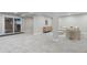 Finished basement with neutral carpet, contemporary furniture, and sliding glass door at 8079 W 67Th Ave, Arvada, CO 80004