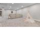 Finished basement with neutral carpet, a play tent and plenty of room for recreation at 8079 W 67Th Ave, Arvada, CO 80004
