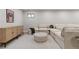 Finished basement featuring a comfortable sectional sofa, modern decor, and neutral carpet at 8079 W 67Th Ave, Arvada, CO 80004
