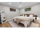 Serene bedroom featuring hardwood floors, recessed lighting, and modern decor at 8079 W 67Th Ave, Arvada, CO 80004