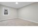Bright bedroom featuring neutral walls and flooring with a window that lets in natural light at 8079 W 67Th Ave, Arvada, CO 80004