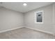 Bright and airy bedroom with neutral walls and flooring featuring a window letting in natural light at 8079 W 67Th Ave, Arvada, CO 80004