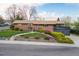 Charming brick home with a well-manicured lawn and mature landscaping enhancing curb appeal at 8079 W 67Th Ave, Arvada, CO 80004