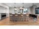 Bright kitchen showcasing a large center island with bar seating, stainless steel appliances, and hardwood floors at 8079 W 67Th Ave, Arvada, CO 80004