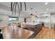Open-concept layout combining living, dining, and kitchen spaces for a modern, airy feel at 8079 W 67Th Ave, Arvada, CO 80004