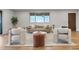 Cozy living room with hardwood floors, contemporary furniture, and ample natural light at 8079 W 67Th Ave, Arvada, CO 80004