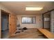 Unfinished basement with weight equipment and storage shelving at 5925 Herzman Dr, Evergreen, CO 80439