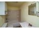 Small bathroom with shower/tub, toilet, and vanity at 5925 Herzman Dr, Evergreen, CO 80439