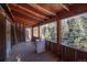 Porch with a view of the snowy woods at 5925 Herzman Dr, Evergreen, CO 80439