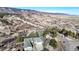 Elevated view of a residential neighborhood with mountain views, mature trees, and private driveways on a sunny day at 6301 Perry Park Blvd # 22, Larkspur, CO 80118