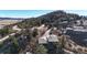 Elevated view of a well-maintained home featuring private balconies and patios surrounded by mature trees in a serene setting at 6301 Perry Park Blvd # 22, Larkspur, CO 80118