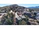 Panoramic view of a mountain home featuring private balconies and patios surrounded by mature trees in a serene community at 6301 Perry Park Blvd # 22, Larkspur, CO 80118