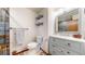 Charming bathroom with rustic blue vanity, modern fixtures, and a beautifully tiled shower at 6301 Perry Park Blvd # 22, Larkspur, CO 80118