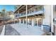 Back of the home showing multiple balconies and a patio, perfect for outdoor living at 6301 Perry Park Blvd # 22, Larkspur, CO 80118