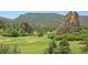 Golf course view showcasing natural rock formations and well-manicured greens at 6301 Perry Park Blvd # 22, Larkspur, CO 80118