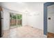 Bright dining area with sliding glass doors to backyard and ceramic tiled floors at 6920 W 48Th Ave, Wheat Ridge, CO 80033