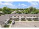 A charming townhome row boasts tidy landscaping, fresh paint and ample parking at 6920 W 48Th Ave, Wheat Ridge, CO 80033