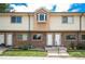 Charming multi-Gathering home with brick and vinyl siding, front lawn and steps leading to front door at 6920 W 48Th Ave, Wheat Ridge, CO 80033