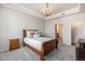 Bedroom featuring carpet floors, a decorative chandelier, and an ensuite bathroom at 7865 Vallagio Ln # 308, Englewood, CO 80112