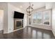 Inviting living room featuring a fireplace, and abundant natural light from the large windows at 7865 Vallagio Ln # 308, Englewood, CO 80112