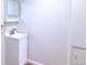 A bathroom featuring a white vanity, mirror cabinet, and modern fixtures at 10878 Patterson Ct, Northglenn, CO 80234