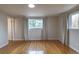 Bedroom with hardwood flooring, white trim, neutral wall color and lots of light at 10878 Patterson Ct, Northglenn, CO 80234