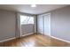 Cozy bedroom with wood floors and double door closet at 10878 Patterson Ct, Northglenn, CO 80234