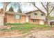 Charming two-story home with brick and vinyl siding and a well-manicured front yard at 10878 Patterson Ct, Northglenn, CO 80234