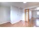 Open hallway area with light wood floors and access to multiple rooms at 10878 Patterson Ct, Northglenn, CO 80234