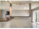 Living room with bar area, fireplace, and sliding doors for outdoor access at 10878 Patterson Ct, Northglenn, CO 80234