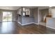 Well-lit living area showcasing hardwood floors and an easy transition to the outdoor space at 10878 Patterson Ct, Northglenn, CO 80234