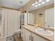 Bright bathroom featuring a vanity, mirror, and tiled flooring at 5800 Tower Rd # 610, Denver, CO 80249