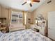 Well-lit bedroom featuring a crib, dresser, and a vanity table, offering a serene space at 5800 Tower Rd # 610, Denver, CO 80249