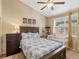 Bright bedroom with a ceiling fan, and a large bed featuring blue floral bedding at 5800 Tower Rd # 610, Denver, CO 80249