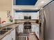 Functional kitchen featuring white cabinets, stainless steel appliances, and a modern aesthetic at 5800 Tower Rd # 610, Denver, CO 80249