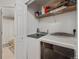 Laundry room includes new washer and dryer units with additional storage space at 5800 Tower Rd # 610, Denver, CO 80249