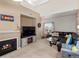 Comfortable living room featuring a fireplace, TV, and a large sectional couch for ample seating at 5800 Tower Rd # 610, Denver, CO 80249