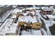 Aerial view of snow-covered townhouses, showcasing community layout at 9624 Martin Luther King Blvd, Denver, CO 80238