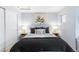 Bright bedroom with a king-size bed and neutral decor at 9624 Martin Luther King Blvd, Denver, CO 80238