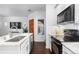 Modern kitchen with stainless steel appliances and marble countertops at 9624 Martin Luther King Blvd, Denver, CO 80238