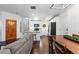 Open concept kitchen and dining area with hardwood floors and modern appliances at 9624 Martin Luther King Blvd, Denver, CO 80238