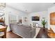 Cozy living room with sectional sofa and large windows at 9624 Martin Luther King Blvd, Denver, CO 80238