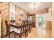 Elegant dining room featuring hardwood floors and a mirrored wall at 1462 S Dudley St, Lakewood, CO 80232