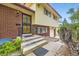 Inviting front entrance with a decorative security door and brick facade details at 1462 S Dudley St, Lakewood, CO 80232